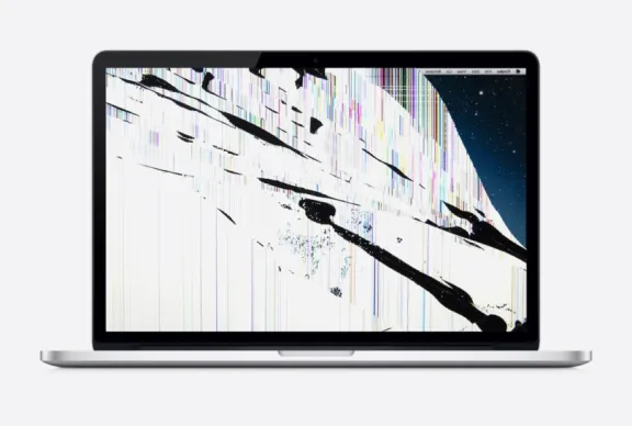 An image of a Macbook with a broken screen